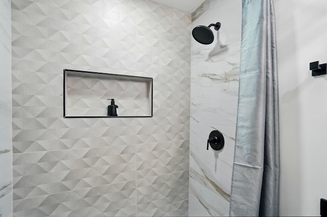 bathroom with a tile shower