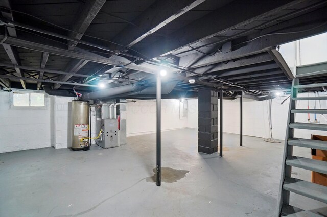 below grade area with heating unit and gas water heater
