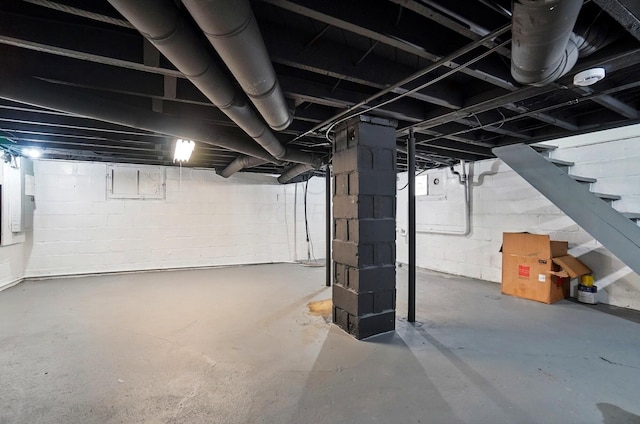 unfinished below grade area featuring stairway