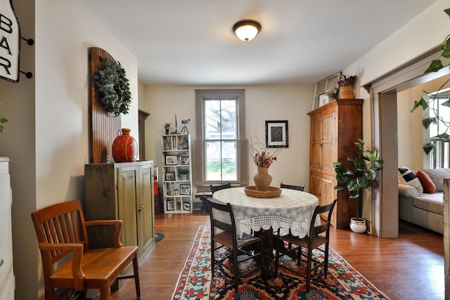 dining space featuring wood finished floors
