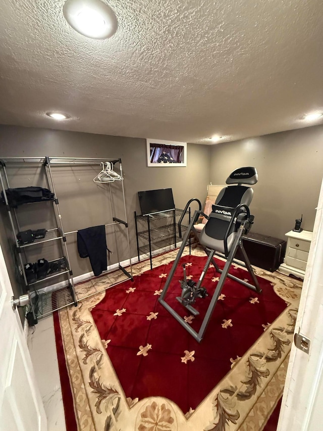 exercise area with a textured ceiling
