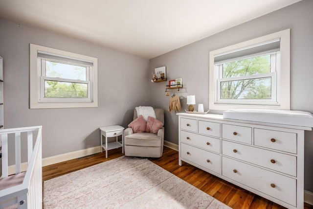 5392 Grandon Dr, Hilliard, OH 43026 - bedroom featuring multiple windows, dark wood-type flooring, and baseboards