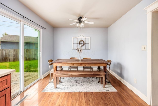 5392 Grandon Dr, Hilliard, OH 43026 - dining room with light wood-style flooring, baseboards, and a ceiling fan