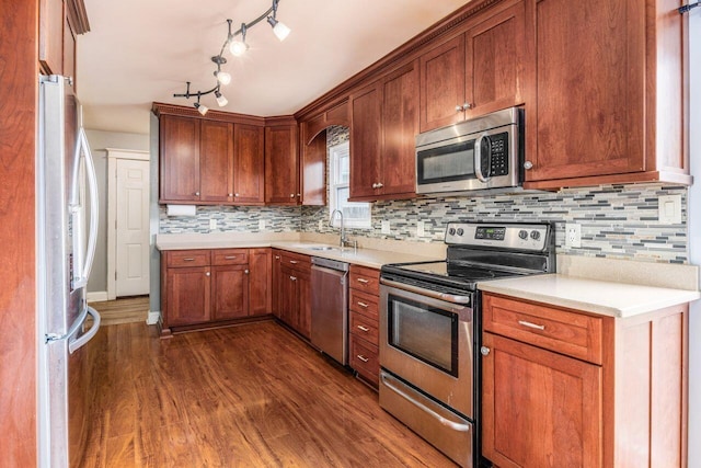 5392 Grandon Dr, Hilliard, OH 43026 - kitchen featuring appliances with stainless steel finishes, a sink, dark wood finished floors, and light countertops