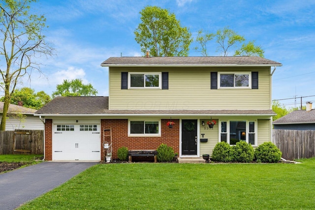 5392 Grandon Dr, Hilliard, OH 43026 - traditional-style house featuring a garage, asphalt driveway, entry steps, and brick siding