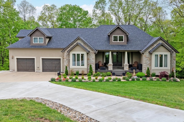 39403 State Route 689, Albany, OH 45710 - craftsman inspired home with a porch, stone siding, driveway, a front yard, and roof with shingles