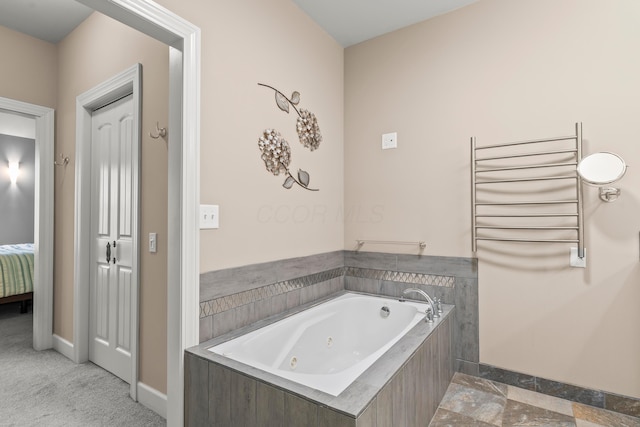 39403 State Route 689, Albany, OH 45710 - bathroom with radiator, a whirlpool tub, baseboards, and ensuite bathroom