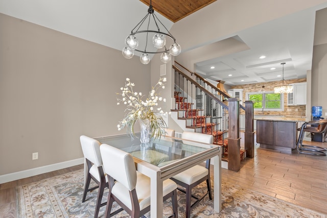 39403 State Route 689, Albany, OH 45710 - dining room featuring a chandelier, light wood-type flooring, recessed lighting, coffered ceiling, and stairway