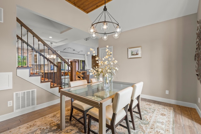 39403 State Route 689, Albany, OH 45710 - dining space with a chandelier, stairway, wood finished floors, baseboards, and recessed lighting