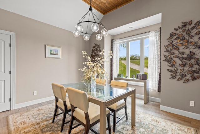 39403 State Route 689, Albany, OH 45710 - dining room with baseboards, light wood finished floors, wood ceiling, and a chandelier
