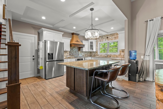 39403 State Route 689, Albany, OH 45710 - kitchen featuring stainless steel refrigerator with ice dispenser, decorative backsplash, white cabinets, wood finish floors, and coffered ceiling