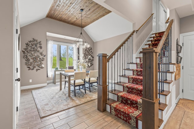 39403 State Route 689, Albany, OH 45710 - foyer entrance featuring stairs, wood finish floors, lofted ceiling, baseboards, and a chandelier