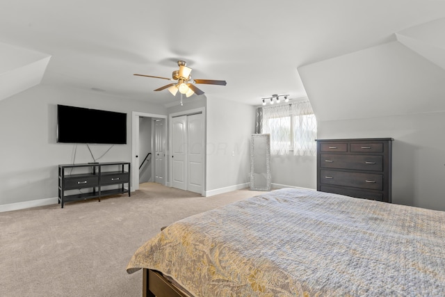 39403 State Route 689, Albany, OH 45710 - bedroom with light carpet, lofted ceiling, baseboards, ceiling fan, and multiple closets