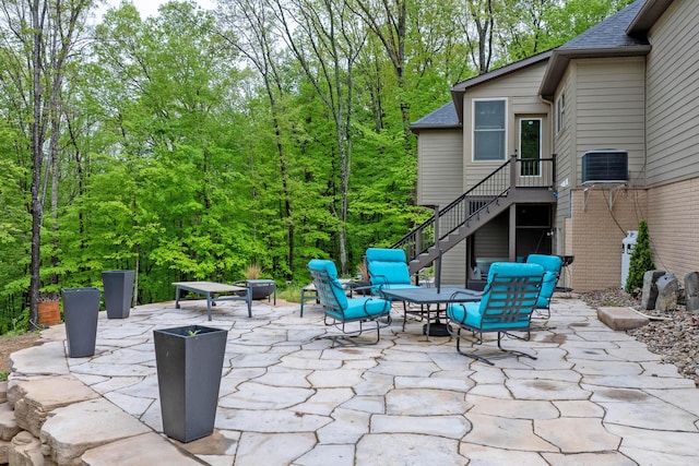 39403 State Route 689, Albany, OH 45710 - view of patio / terrace featuring stairway and central air condition unit
