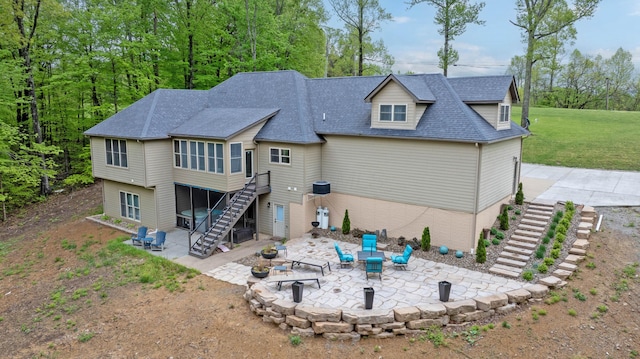 39403 State Route 689, Albany, OH 45710 - rear view of house featuring stairs, a patio, an outdoor fire pit, and a shingled roof