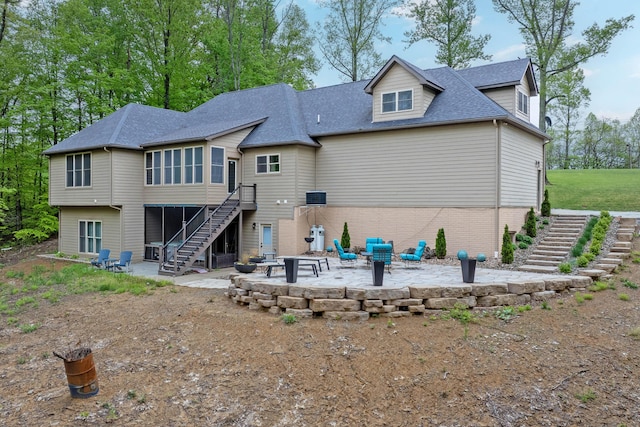 39403 State Route 689, Albany, OH 45710 - rear view of house featuring stairway, a patio, an outdoor fire pit, and brick siding
