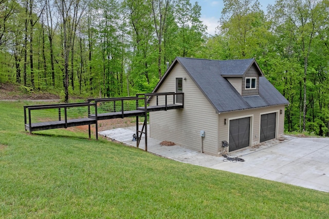 39403 State Route 689, Albany, OH 45710 - view of property exterior with a detached garage, a yard, and a shingled roof