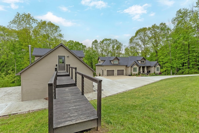 39403 State Route 689, Albany, OH 45710 - view of front of house featuring a front yard, concrete driveway, and a garage