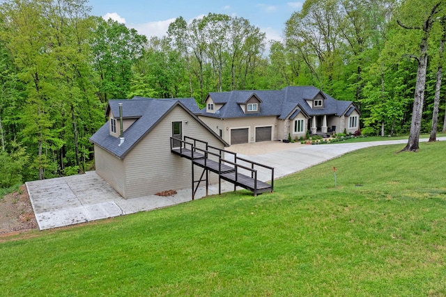 39403 State Route 689, Albany, OH 45710 - view of front of house featuring driveway, a front lawn, and a garage
