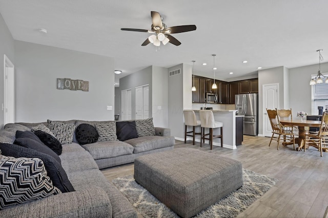 149 Broadmoore Blvd, Pataskala, OH 43062 - living area with recessed lighting, ceiling fan, visible vents, and light wood-style flooring