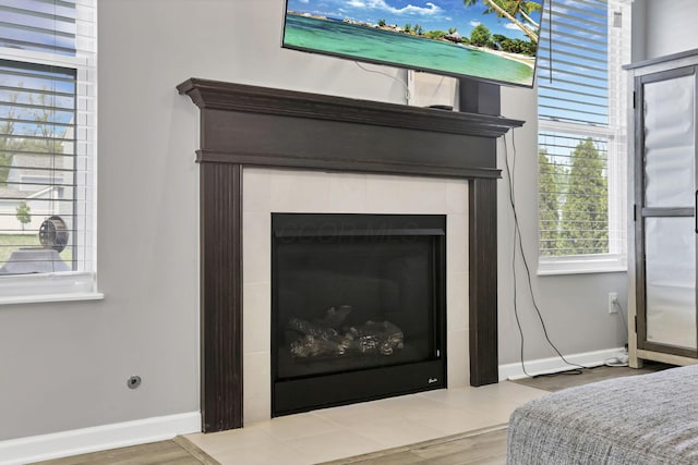 149 Broadmoore Blvd, Pataskala, OH 43062 - interior details featuring baseboards, wood finished floors, and a tile fireplace
