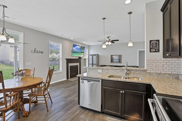149 Broadmoore Blvd, Pataskala, OH 43062 - kitchen with a sink, open floor plan, light wood-style flooring, and dishwasher