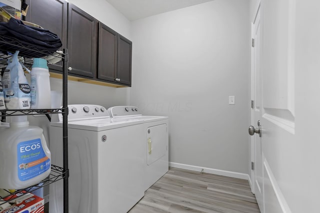 149 Broadmoore Blvd, Pataskala, OH 43062 - washroom featuring washer and dryer, baseboards, light wood finished floors, and cabinet space