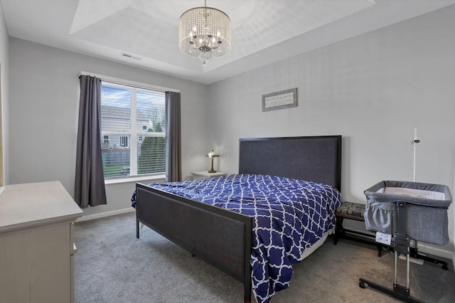 149 Broadmoore Blvd, Pataskala, OH 43062 - bedroom featuring visible vents, baseboards, a chandelier, a tray ceiling, and carpet