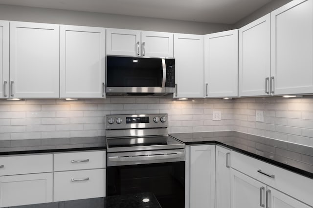 134 Chrisman Ave, London, OH 43140 - kitchen with white cabinetry, appliances with stainless steel finishes, and decorative backsplash