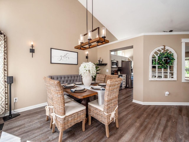 dining space featuring baseboards, ornamental molding, and dark wood-type flooring