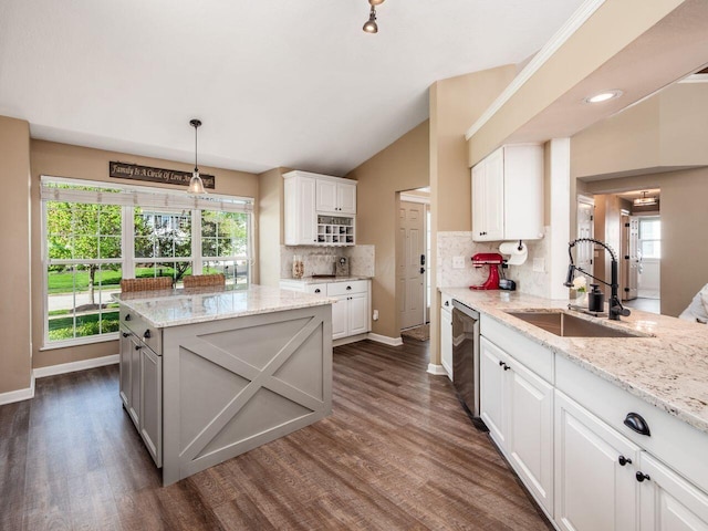kitchen with plenty of natural light, a sink, and decorative backsplash