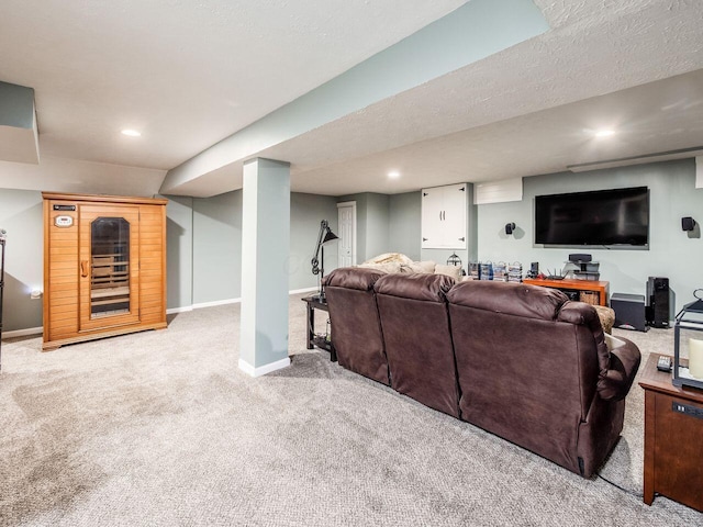 carpeted living area with baseboards and recessed lighting