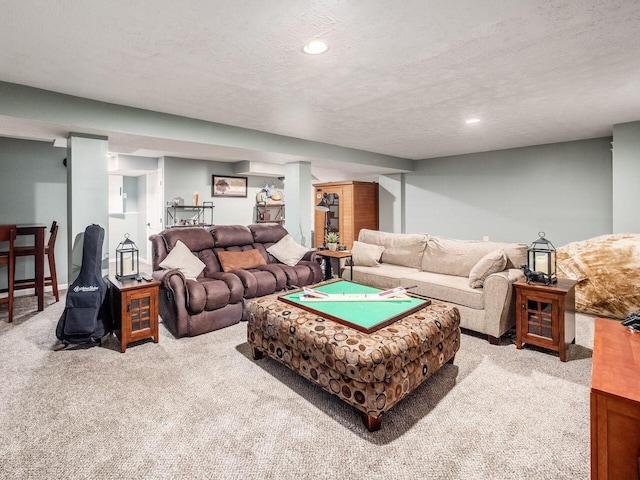 carpeted living room featuring recessed lighting and a textured ceiling