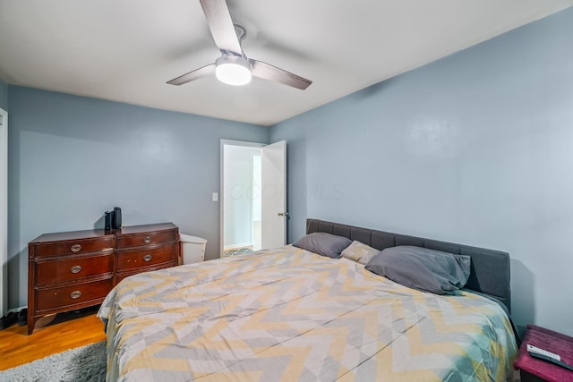 bedroom featuring ceiling fan and wood finished floors