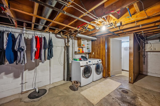 unfinished basement featuring washing machine and dryer