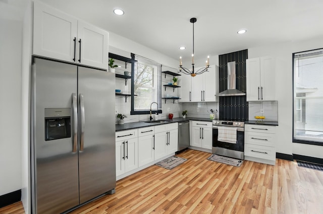 kitchen with stainless steel appliances, open shelves, dark countertops, and wall chimney exhaust hood