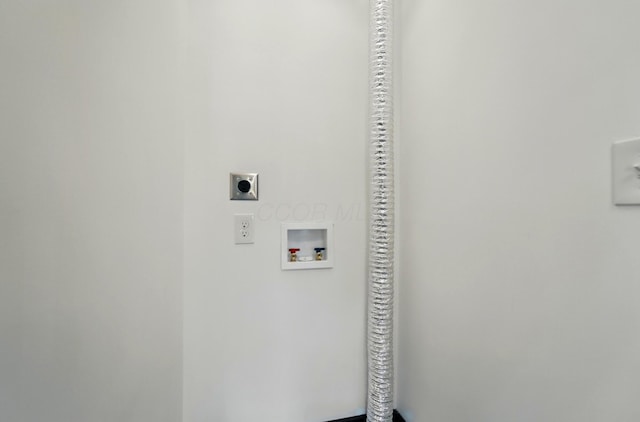 clothes washing area with electric dryer hookup, laundry area, and hookup for a washing machine