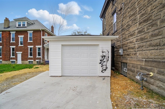 garage with concrete driveway