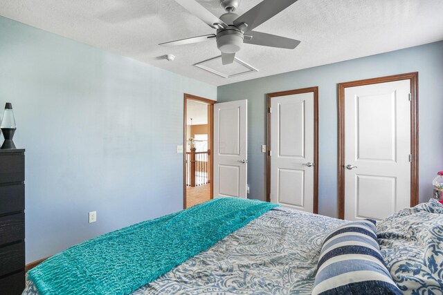bedroom featuring a textured ceiling and ceiling fan