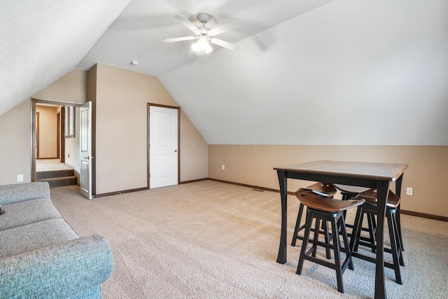 bonus room with carpet floors, a ceiling fan, baseboards, and vaulted ceiling