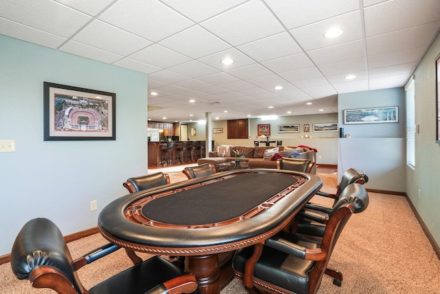 recreation room with baseboards, recessed lighting, carpet floors, and a paneled ceiling