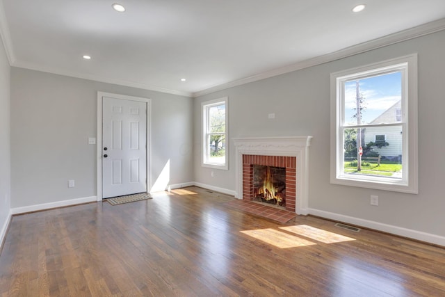 unfurnished living room with recessed lighting, baseboards, ornamental molding, and wood finished floors