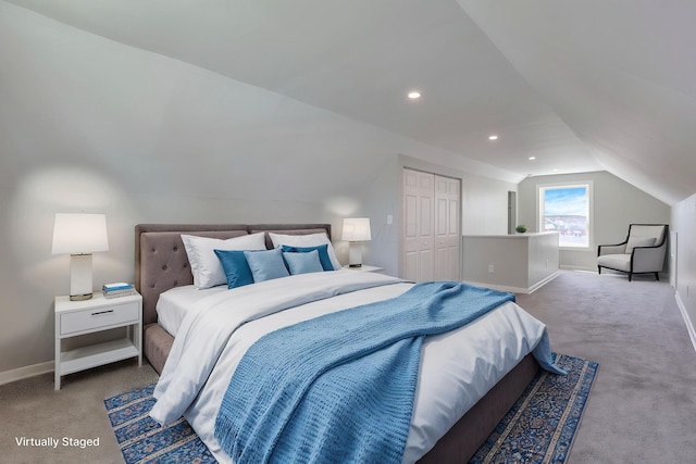 carpeted bedroom with baseboards, recessed lighting, lofted ceiling, and a closet
