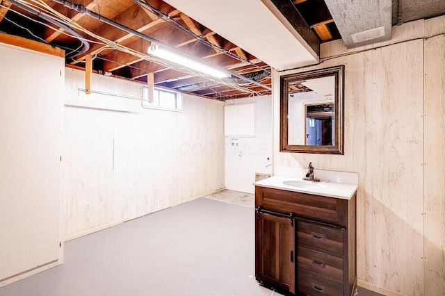 below grade area with a sink