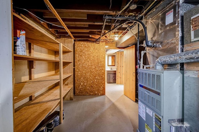 unfinished basement featuring heating unit