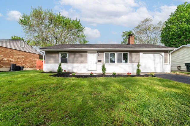 1727 Niagara Rd, Columbus, OH 43227 - ranch-style home with driveway, a chimney, an attached garage, and a front yard