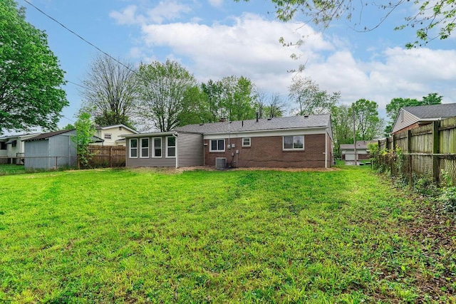 1727 Niagara Rd, Columbus, OH 43227 - rear view of house with cooling unit and brick siding