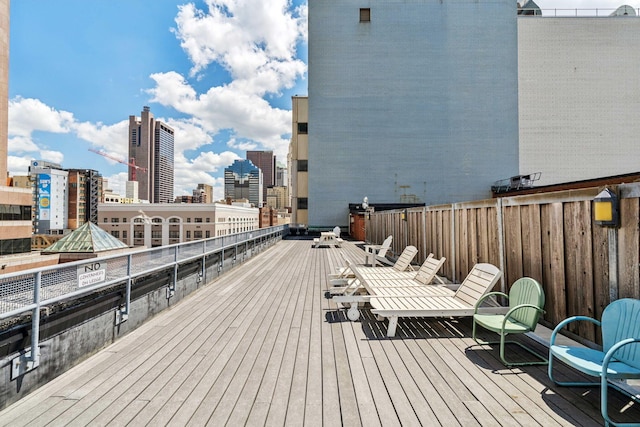 wooden deck with a city view