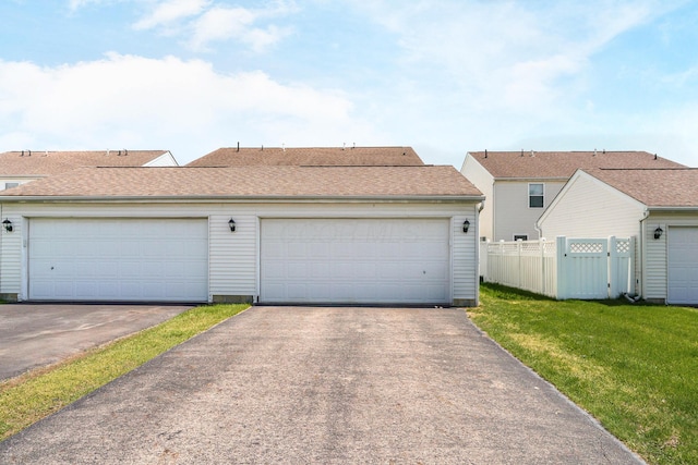 garage featuring fence