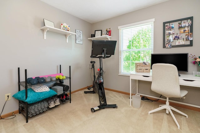 carpeted office featuring baseboards